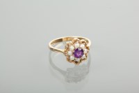 Lot 1210 - AMETHYST AND PEARL DRESS RING the central...