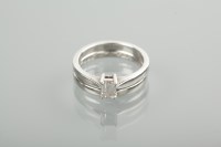 Lot 1222 - DIAMOND SOLITAIRE RING the emerald cut stone 0....