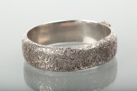 Lot 1231 - VICTORIAN SILVER BANGLE with engraved...