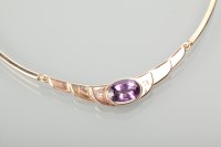 Lot 1238 - NINE CARAT ROSE GOLD AMETHYST AND DIAMOND SET...