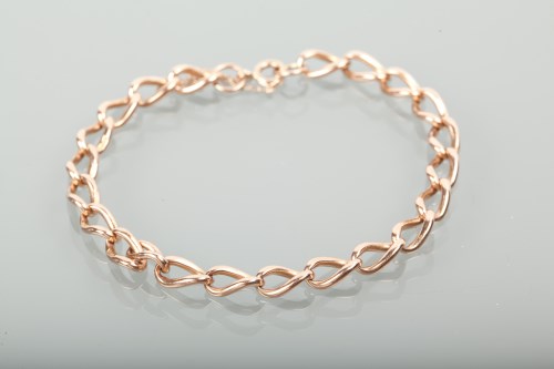 Lot 1259 - NINE CARAT ROSE GOLD BELCHER LINK BRACELET...