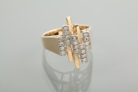 Lot 1266 - MODERNIST STYLE DIAMOND RING with twenty round...