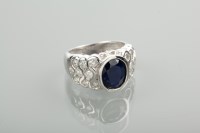 Lot 1270 - SAPPHIRE AND DIAMOND RING the central oval...