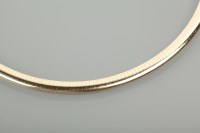 Lot 1284 - FOURTEEN CARAT GOLD SLIDER NECKLACE 6mm wide,...