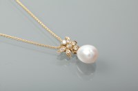 Lot 1313 - PEARL AND DIAMOND PENDANT of floral design set...