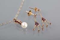 Lot 1320A - GARNET AND PEARL SET PENDANT set with a single...