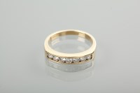 Lot 1321 - DIAMOND HALF ETERNITY RING channel set with...