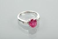 Lot 1330 - RUBY AND DIAMOND RING the oval cut ruby...