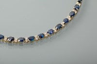 Lot 1342 - SAPPHIRE AND DIAMOND BRACELET set with oval...