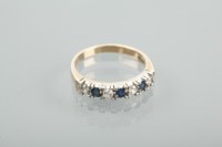 Lot 1351 - SAPPHIRE AND DIAMOND RING set with four...