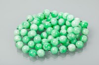 Lot 1382 - JADE BEAD NECKLACE the spherical green beads...