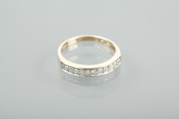 Lot 1384 - DIAMOND HALF ETERNITY RING set with brilliant...