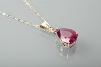 Lot 1386 - RUBY AND DIAMOND PENDANT the pear cut ruby...