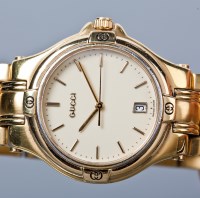 Lot 1080 - GENTLEMAN'S GUCCI WRIST WATCH the cream...