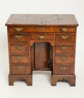 Lot 485 - GEORGE II CROSSBANDED WALNUT KNEEHOLE DRESSING...