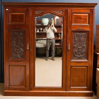 Lot 502 - LATE VICTORIAN CARVED MAHOGANY TRIPLE WARDROBE...