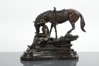 Lot 529 - AFTER MASIER COWBOY AT REST bronze, signed...