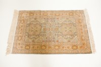 Lot 543 - PERSIAN SILK AND COTTON RUG with floral pale...