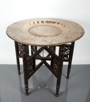 Lot 119 - INDIAN BRASS TOPPED TABLE the circular top...