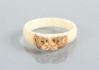 Lot 200A - JAPANESE IVORY RING modelled with two monkeys