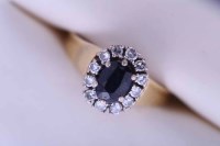 Lot 1859 - SAPPHIRE AND DIAMOND CLUSTER RING with a...