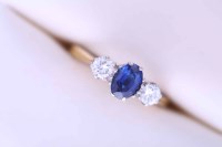 Lot 1876 - SAPPHIRE AND DIAMOND THREE STONE RING the...