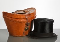 Lot 373 - BLACK SILK TOP HAT in leather carry case,...