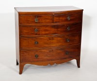 Lot 407 - REGENCY BOWFRONT MAHOGANY CHEST with two short...