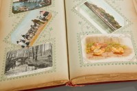 Lot 454 - POSTAL HISTORY: A POSTCARD ALBUM circa 1905,...