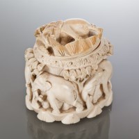 Lot 57 - INDIAN IVORY CARVED BOX of oval form and with...