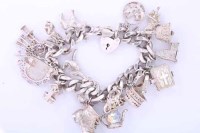 Lot 1934 - SILVER CHARM BRACELET with charms including a...