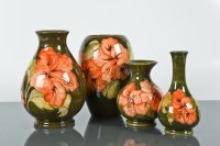 Lot 150 - FOUR MOORCROFT VASES each with tube lined...