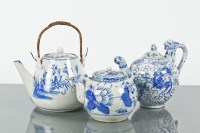 Lot 155 - FIVE CHINESE TEAPOTS comprising three blue and...