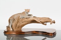 Lot 193 - WILD TRACKS CERAMIC FIGURE OF A LEOPARD on a...