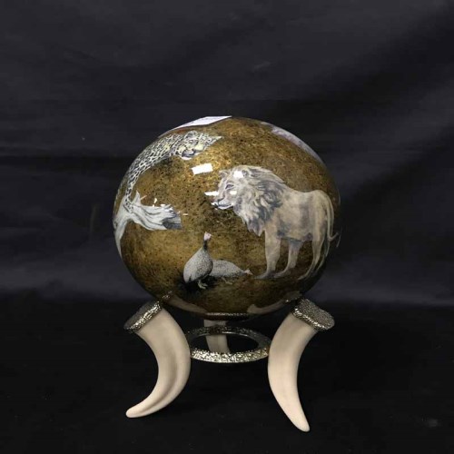 Lot 42 - PAINTED OSTRICH EGG depicting African wildlife,...