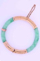 Lot 1961 - JADE BANGLE the jade of a vibrant green tone,...