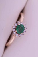 Lot 1965 - EMERALD AND DIAMOND CLUSTER RING the central...