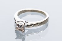 Lot 1967A - DIAMOND SOLITAIRE RING the central princess...