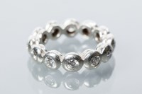 Lot 1983A - DIAMOND FULL ETERNITY RING BY GARRARD & CO set...