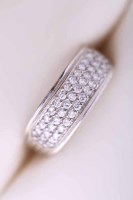 Lot 1988 - DIAMOND CLUSTER RING set with three rows of...