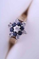 Lot 1989 - DIAMOND AND SAPPHIRE RING of floral form, set...