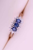 Lot 1992 - THREE STONE SAPPHIRE AND DIAMOND CLUSTER RING...