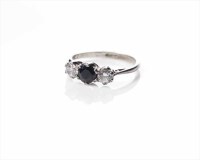 Lot 1992A - SAPPHIRE THREE STONE RING the central oval...