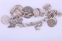 Lot 1995A - STERLING SILVER CHARM BRACELET with charms...