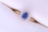 Lot 2008 - SAPPHIRE AND DIAMOND CLUSTER RING with a...