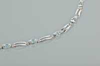 Lot 1109 - AQUAMARINE AND DIAMOND BRACELET set with oval...