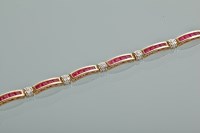 Lot 1112 - RUBY AND DIAMOND BRACELET set with square cut...