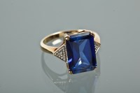 Lot 1124 - SYNTHETIC SAPPHIRE AND DIAMOND DRESS RING set...