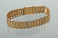 Lot 1138 - 1970S GOLD BRACELET formed by two sizes of...
