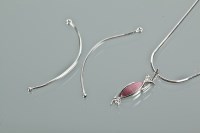 Lot 1143 - PURPLE GOLD AND DIAMOND PENDANT of openwork...